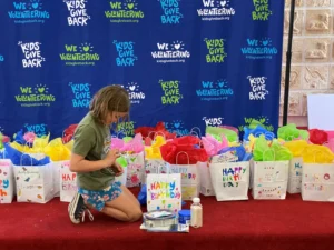 A girl looking at the contents of the loot bag