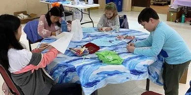 Children painting a huge cloth